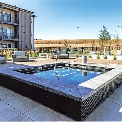 Apartment complex with a hot tub outside